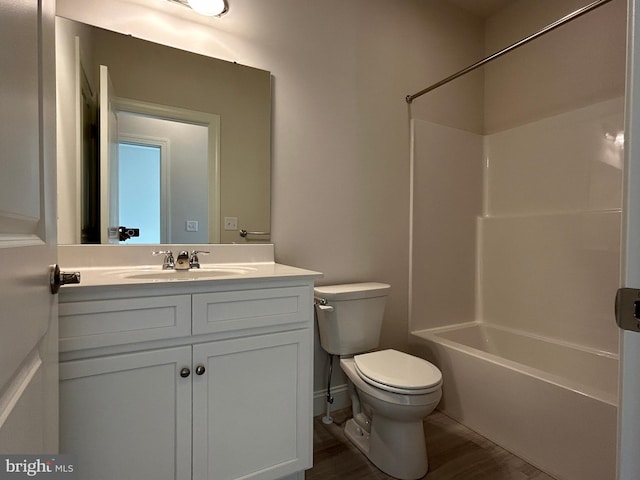 full bathroom with vanity,  shower combination, toilet, and wood-type flooring