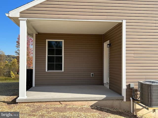 doorway to property with cooling unit