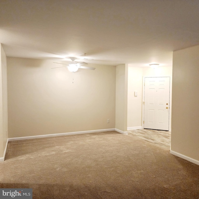 carpeted empty room with ceiling fan