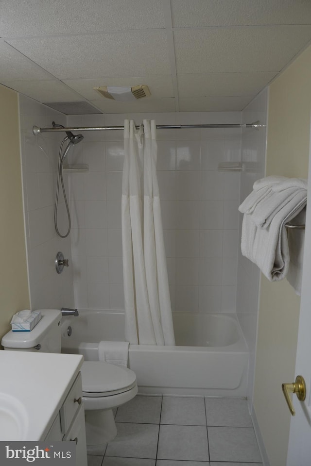 full bathroom featuring tile patterned flooring, vanity, toilet, and shower / bathtub combination with curtain