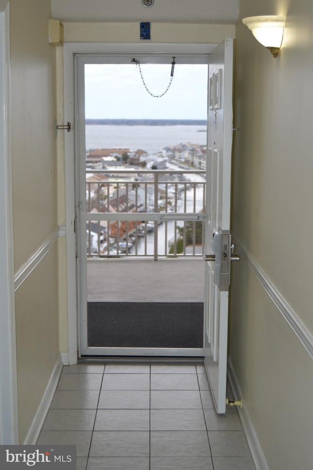 entryway with light tile patterned floors