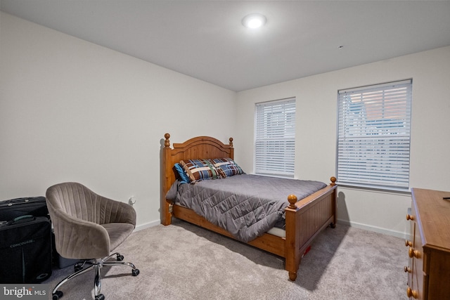 bedroom with light colored carpet