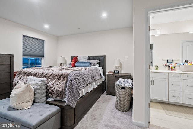 bedroom featuring light colored carpet