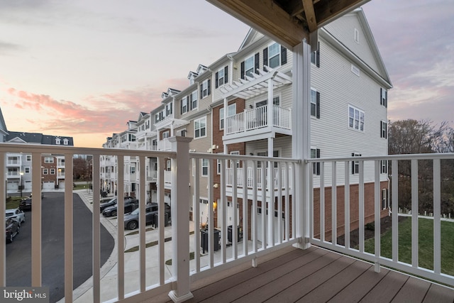 view of balcony at dusk