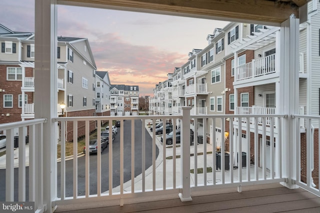 balcony at dusk with central air condition unit