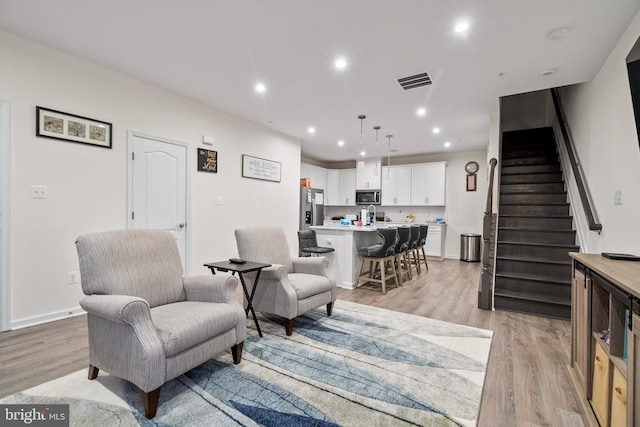 living room featuring light hardwood / wood-style floors