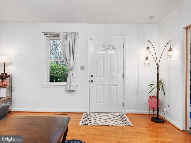 foyer entrance with light wood-type flooring