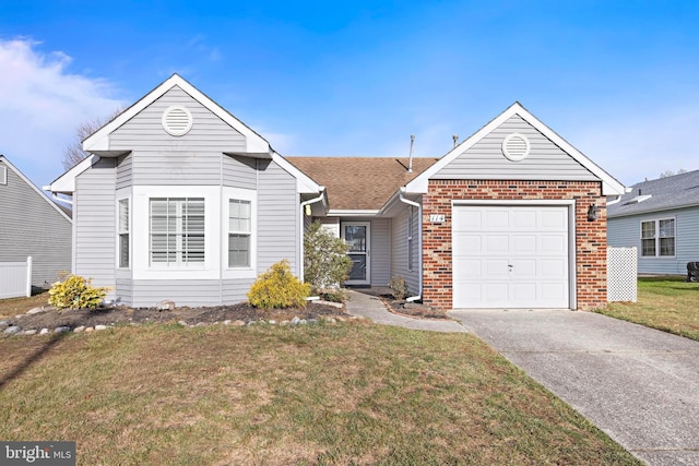 view of front of house featuring a garage and a front lawn