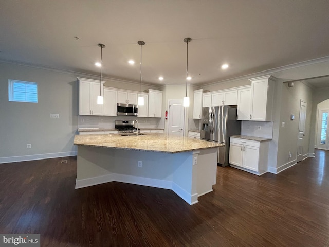 kitchen featuring hanging light fixtures, dark hardwood / wood-style floors, a kitchen island with sink, white cabinets, and appliances with stainless steel finishes