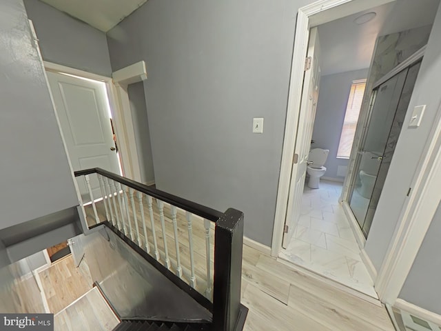 stairs featuring hardwood / wood-style flooring