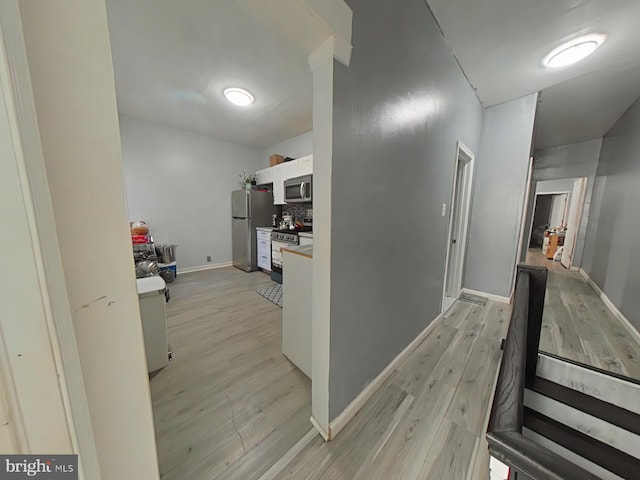 corridor featuring light hardwood / wood-style flooring