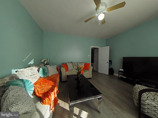 living room featuring hardwood / wood-style floors and ceiling fan