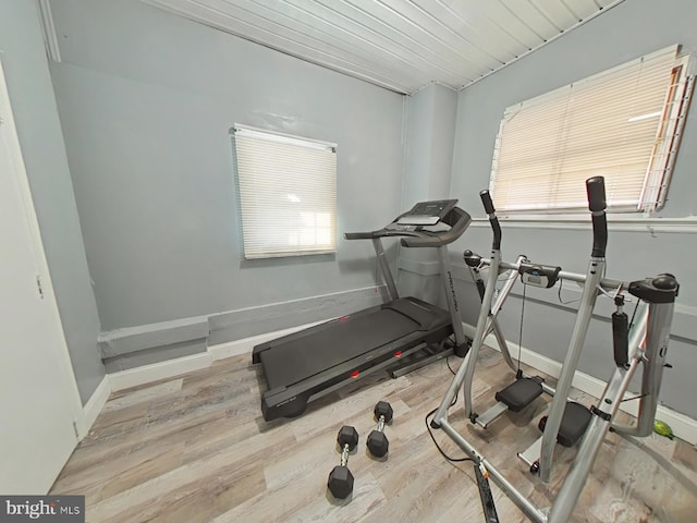 workout area with wood-type flooring and wood ceiling