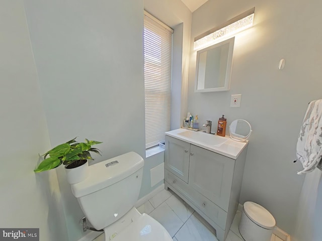 bathroom with tile patterned floors, vanity, and toilet