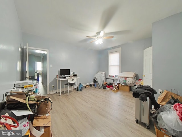 interior space featuring light wood-type flooring and ceiling fan