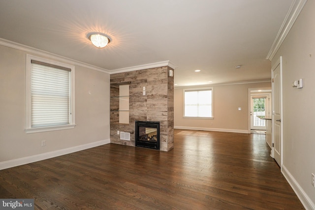 unfurnished living room featuring a multi sided fireplace, dark hardwood / wood-style floors, and crown molding