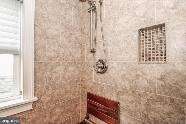 bathroom featuring tiled shower