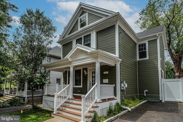 greek revival house featuring a porch