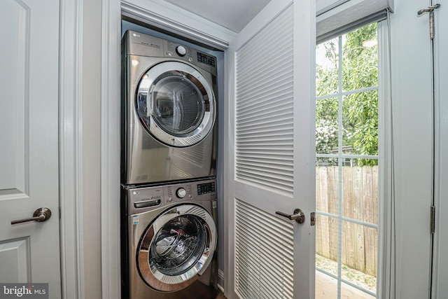 laundry room with stacked washer and dryer