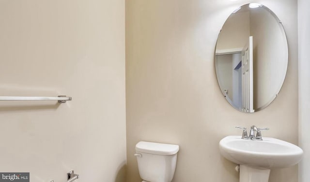 bathroom with toilet and sink