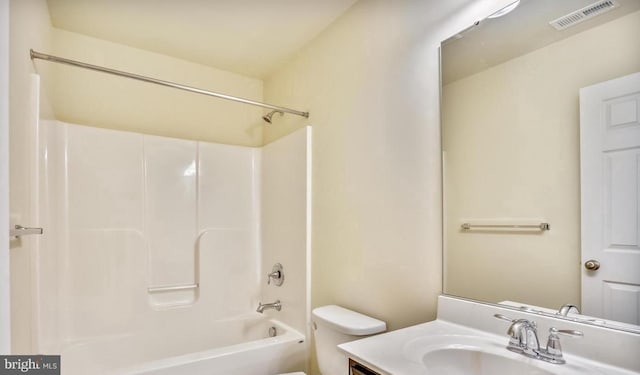 full bathroom featuring toilet, vanity, and  shower combination