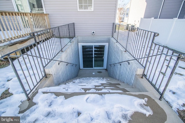 view of snow covered property entrance