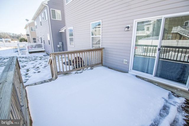 view of snow covered deck