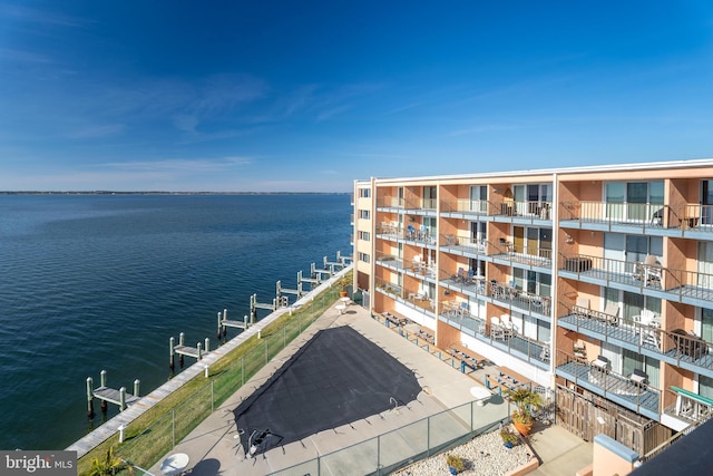 balcony with a dock and a water view