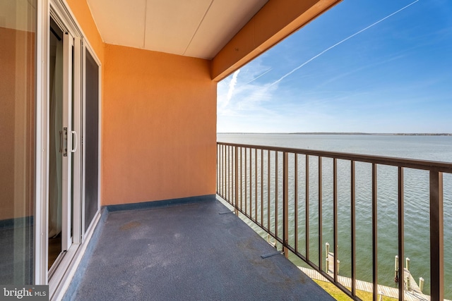 balcony featuring a water view