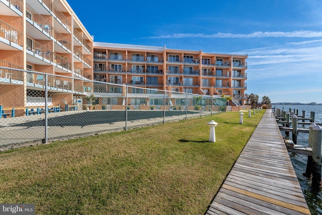 exterior space featuring a yard and a water view