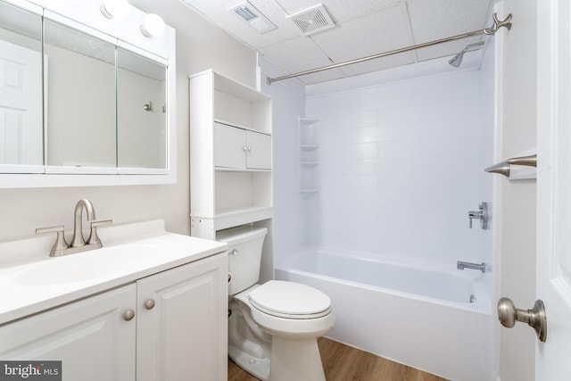 bathroom featuring visible vents, toilet, wood finished floors, and vanity