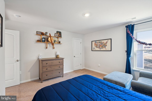 bedroom featuring light colored carpet