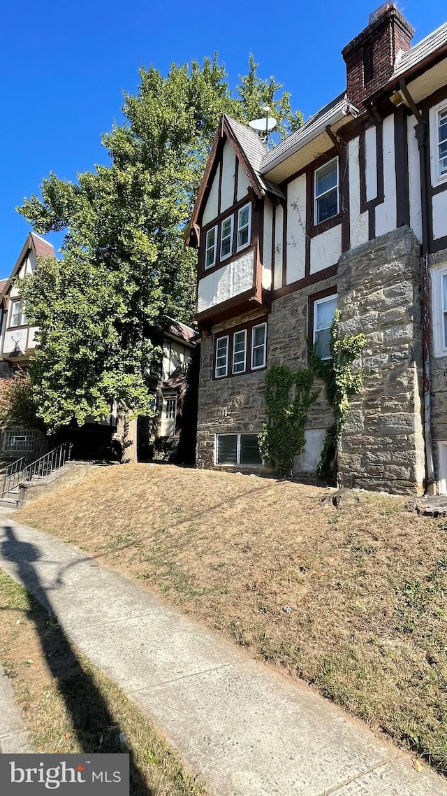 view of home's exterior with a lawn