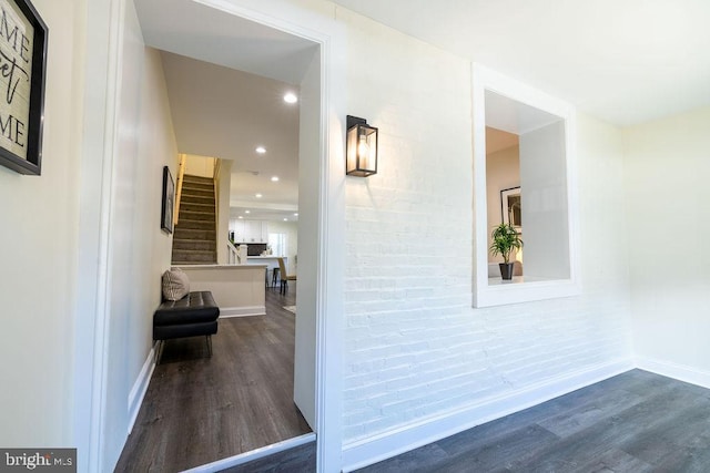 hall with dark hardwood / wood-style floors