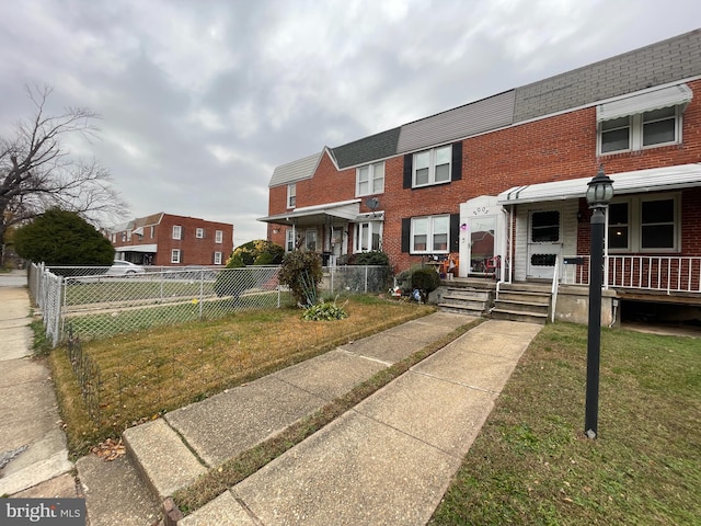 view of property with a front lawn