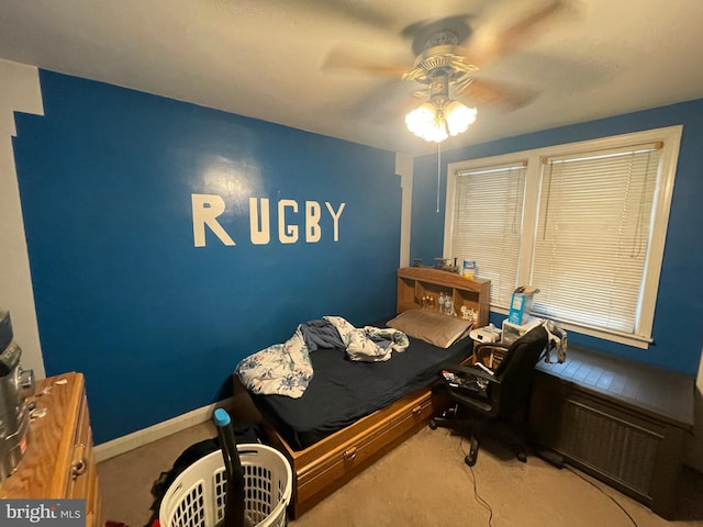 carpeted bedroom with ceiling fan