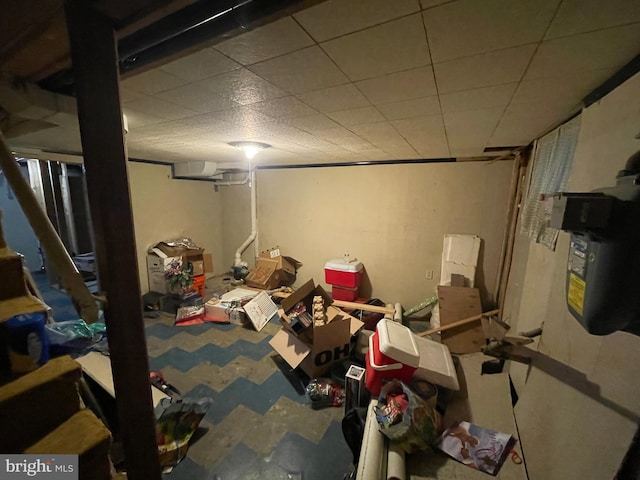 basement featuring a drop ceiling