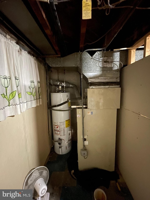 utility room with gas water heater and heating unit