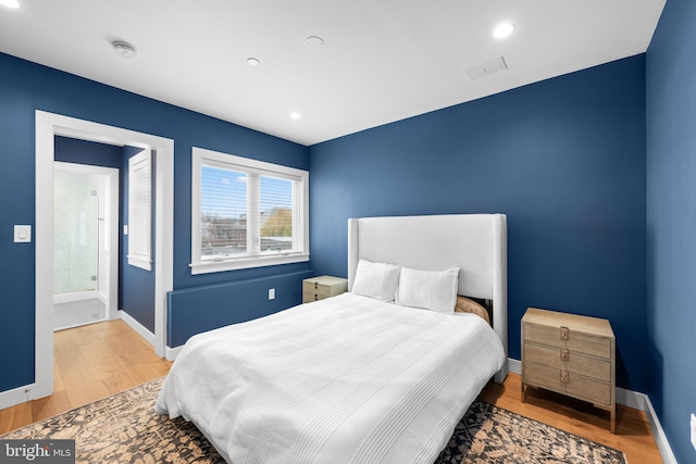 bedroom featuring hardwood / wood-style flooring