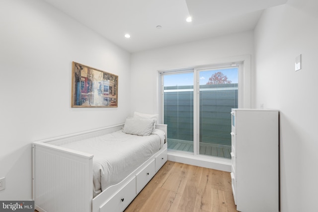 bedroom with light hardwood / wood-style flooring