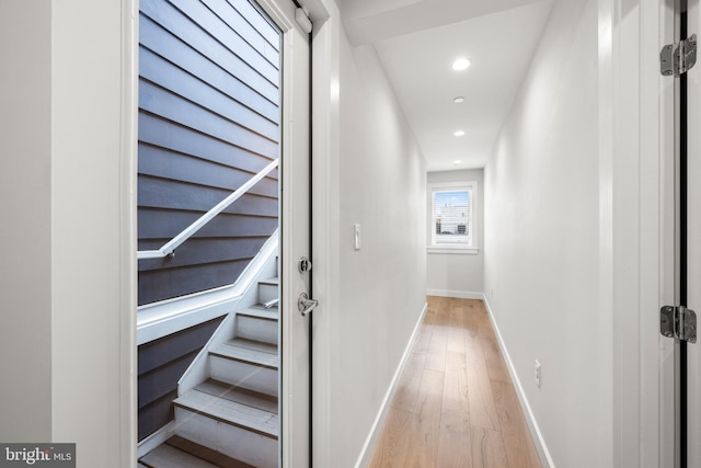 hall with light hardwood / wood-style floors