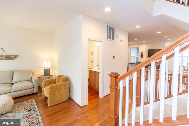 living room featuring a wealth of natural light and light wood-type flooring