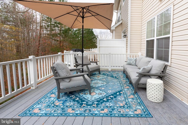 wooden deck featuring outdoor lounge area