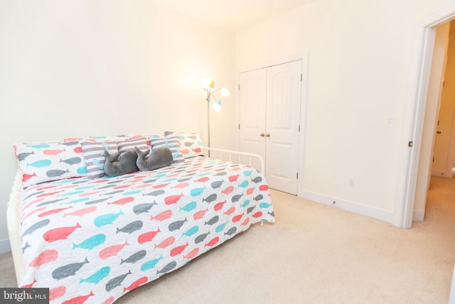 carpeted bedroom featuring a closet