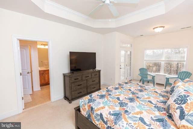 bedroom featuring light carpet, a raised ceiling, ceiling fan, and crown molding