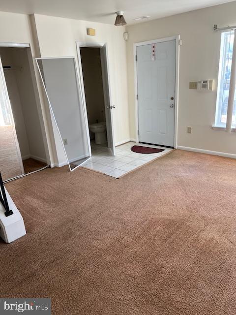 view of carpeted entrance foyer