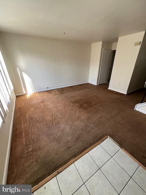 spare room featuring tile patterned flooring