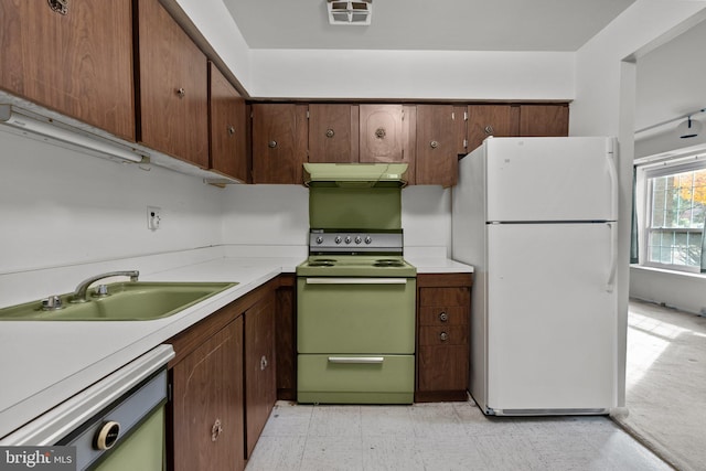 kitchen with white appliances and sink