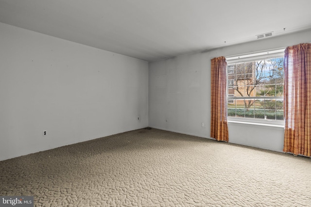 empty room featuring carpet floors