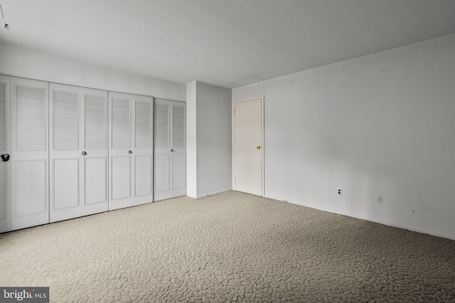 unfurnished bedroom with carpet flooring